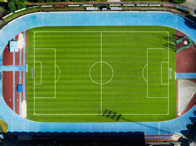 Aerial view of freshly cut football field.